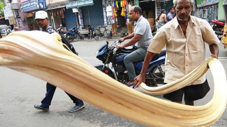 印度街头版麦芽糖，这臂力快把糖甩出街了，画面太震撼