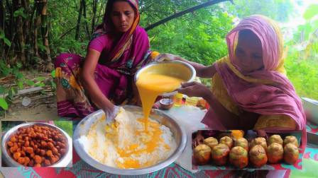 印度农村妇女制作美食，用棕榈果制作糕点，颜色看着十分诱人！
