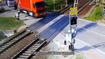 美国大货车被卡铁轨，老司机嚣张举动，让人拍手叫好！